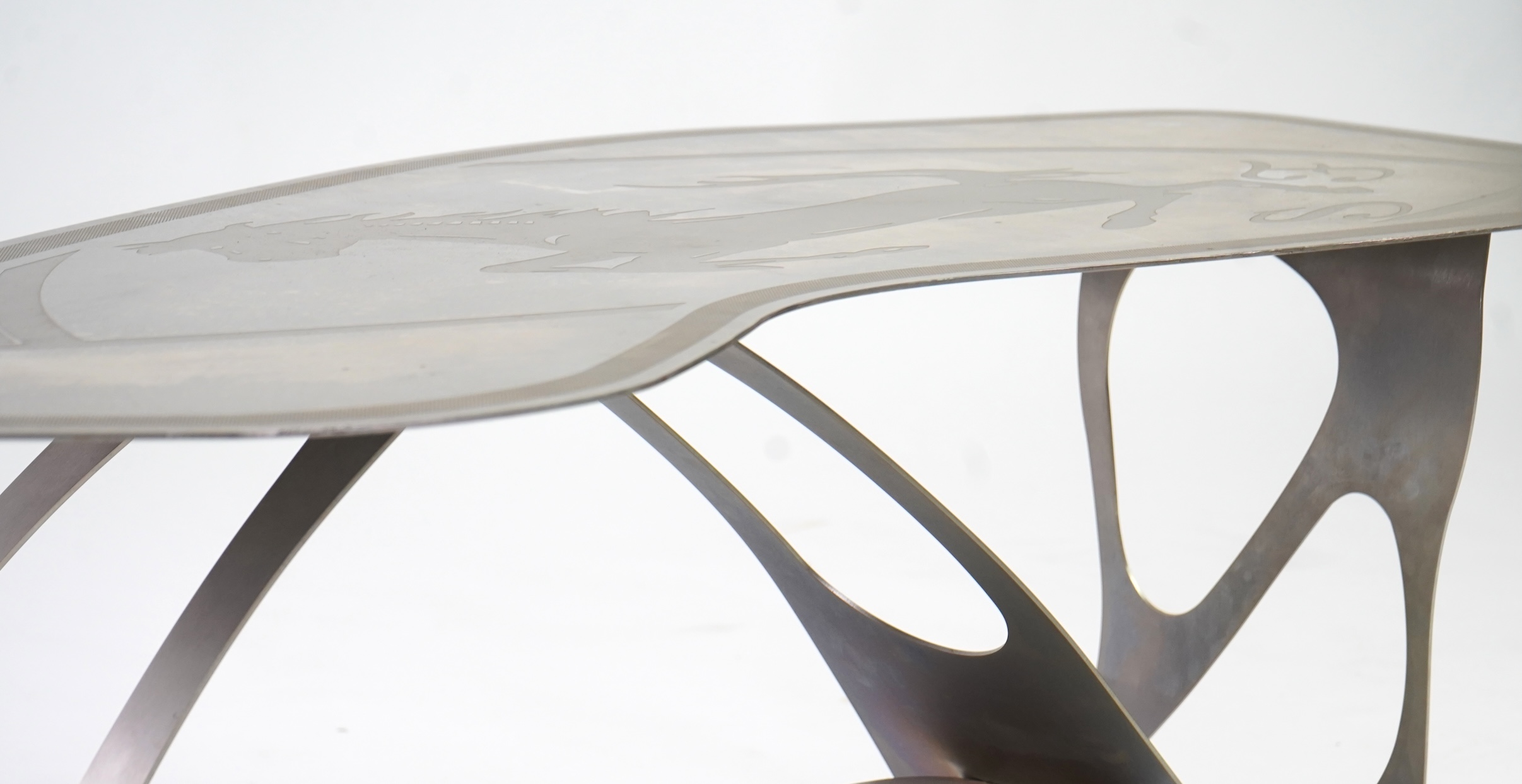 Pietro Psaier (Italian 1939-2004) A Ferrari polished steel coffee table, 1 of 3, in homage to Carlo Mollino